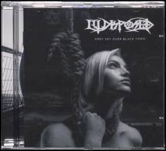 Grey sky over black town